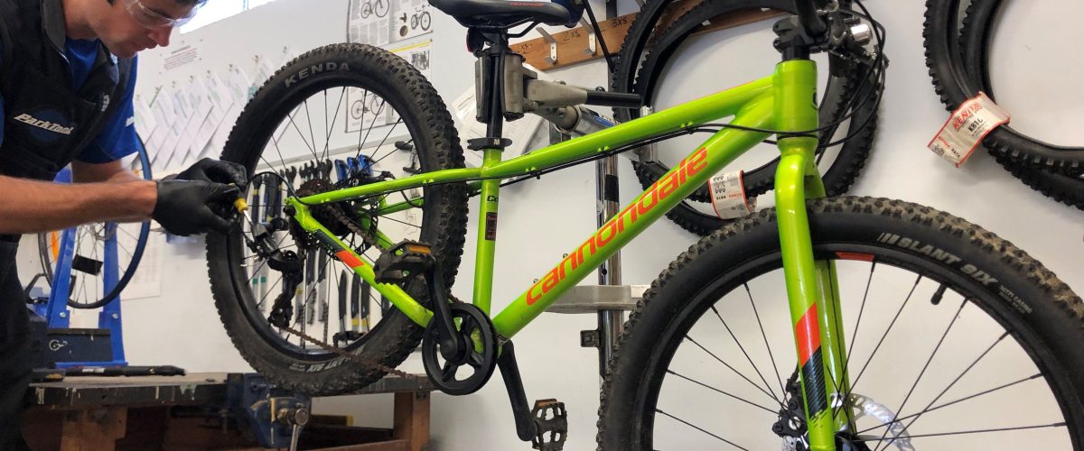 Adventure Aberdeen mechanic working in the bike workshop