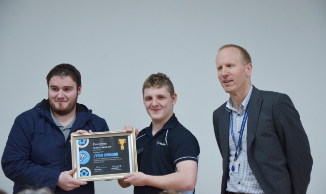 SPACE participant Jyden at a presentation for his volunteering achievements